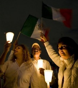 Demonstrators hold up candles at the main Zocalo square in Mexico City during a protest against the tide of killings, kidnappings and shootouts sweeping the country, Saturday, Aug. 30, 2008. More than 13 anti-crime groups planned for tens of thousands of people to join marches in all 32 Mexican states Saturday evening, urging people to walk in silence with candles or lanterns.